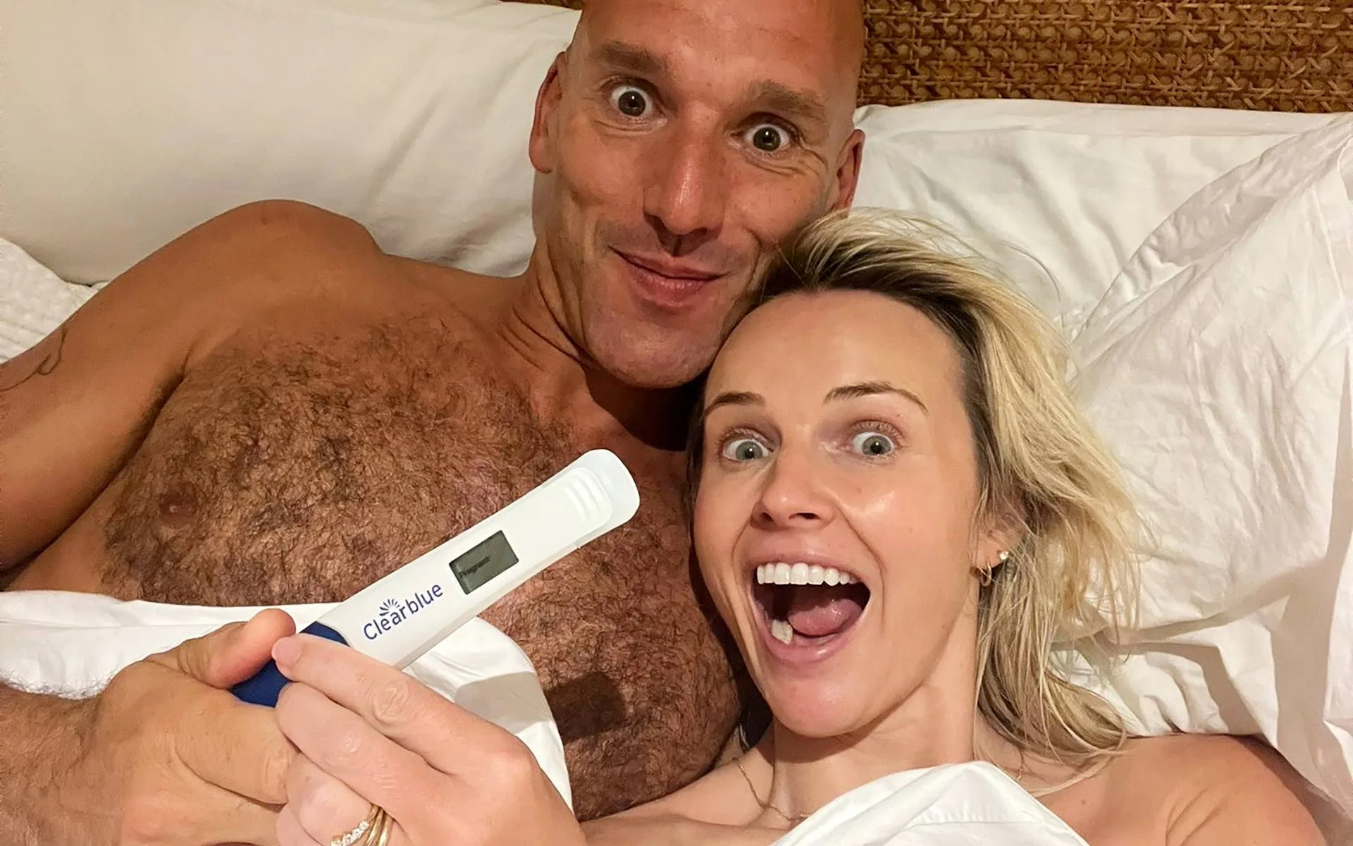 Kim Crossman and hubby Tom in bed with the 'pregnant' test