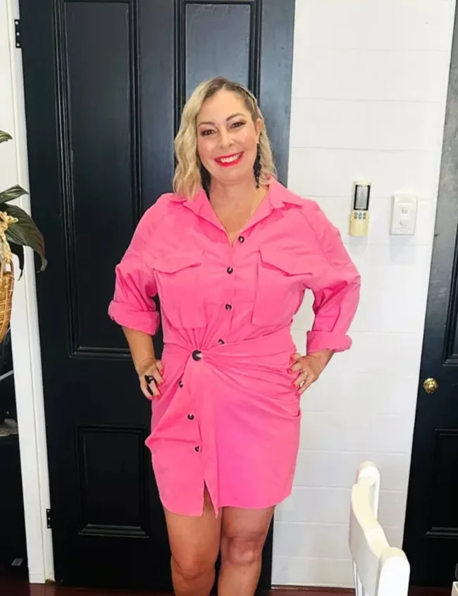 Rhiannon Anderson wearing a bright pink dress