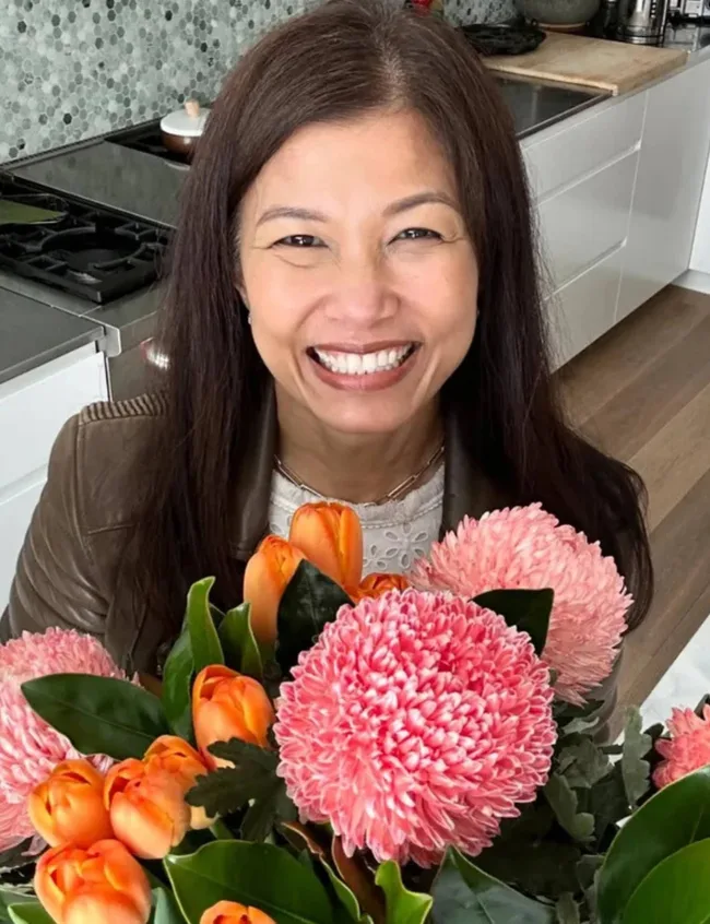 Audra Morrice with a bouquet of flowers