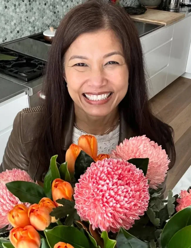 Audra Morrice with a bouquet of flowers