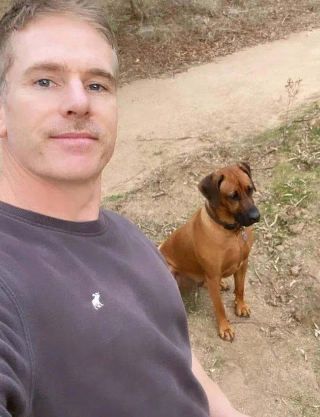 Beau Cook taking a selfie with his dog