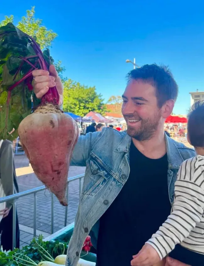 Callum Hann holding an oversized turnip