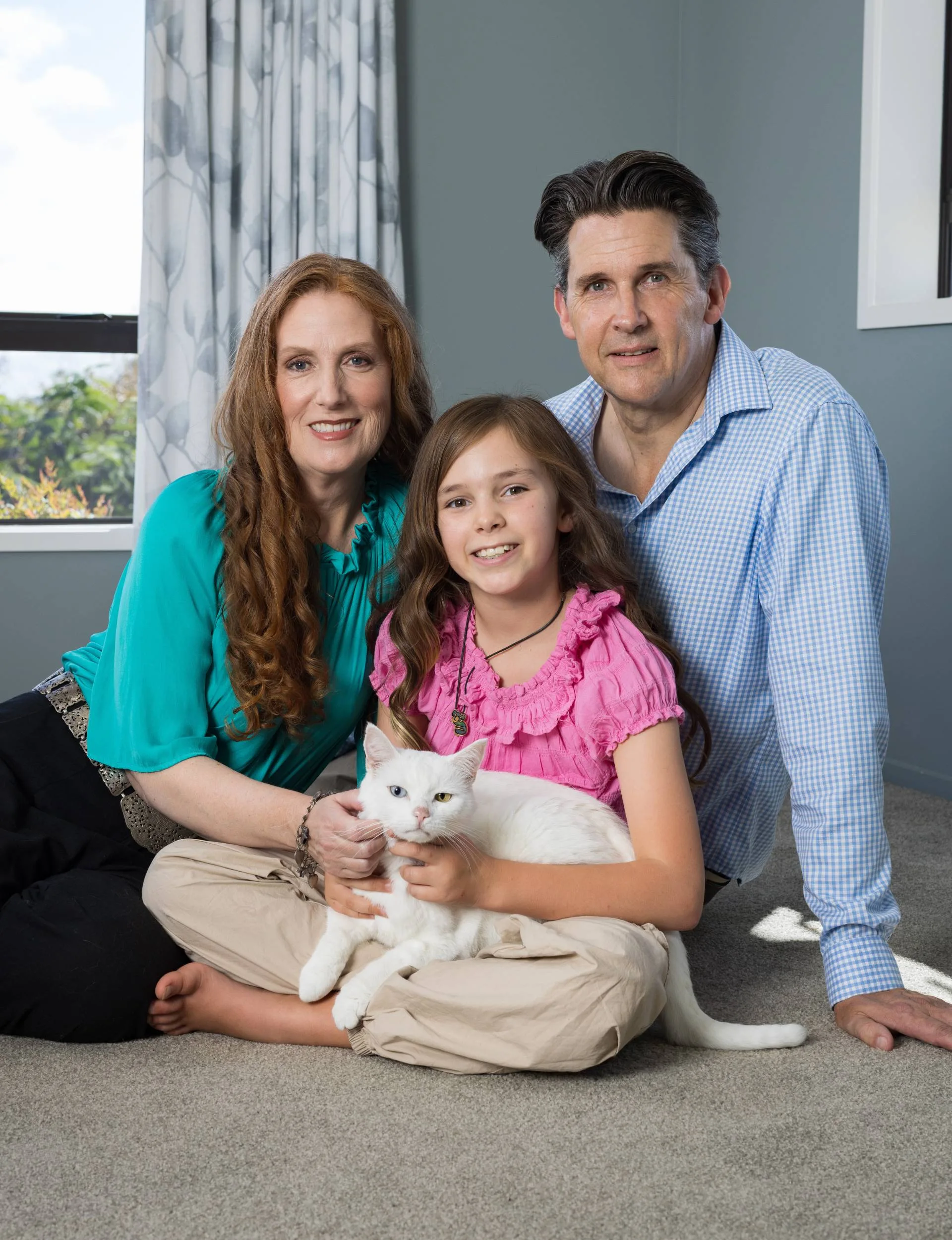 Catherine Chidgey with her husband, daughter and cat