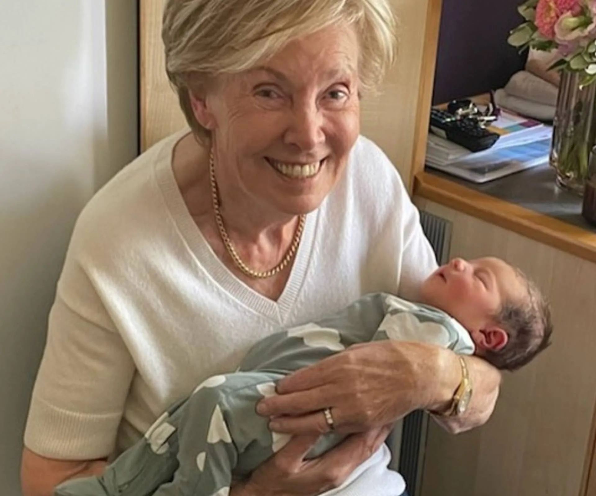 Nicky's mum holding a baby