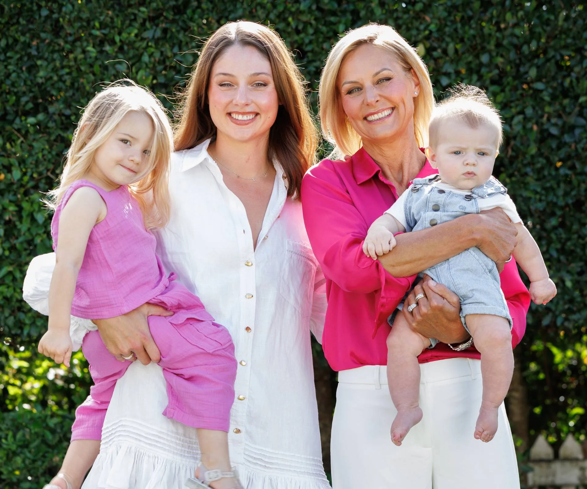Nicky Styris holding her grandson beside her daughter, whose holding her daughter