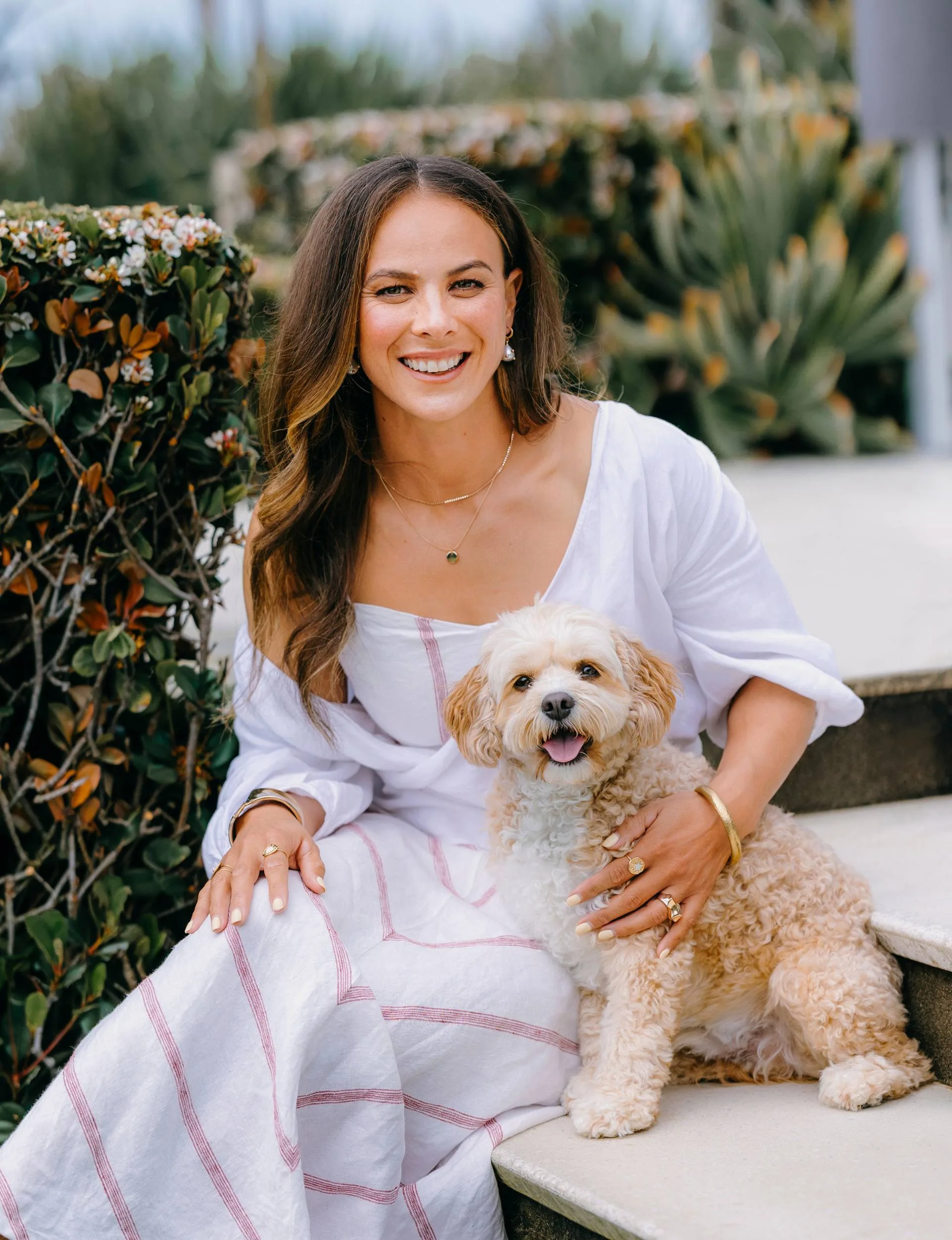 Dame Lisa with her pup at home
