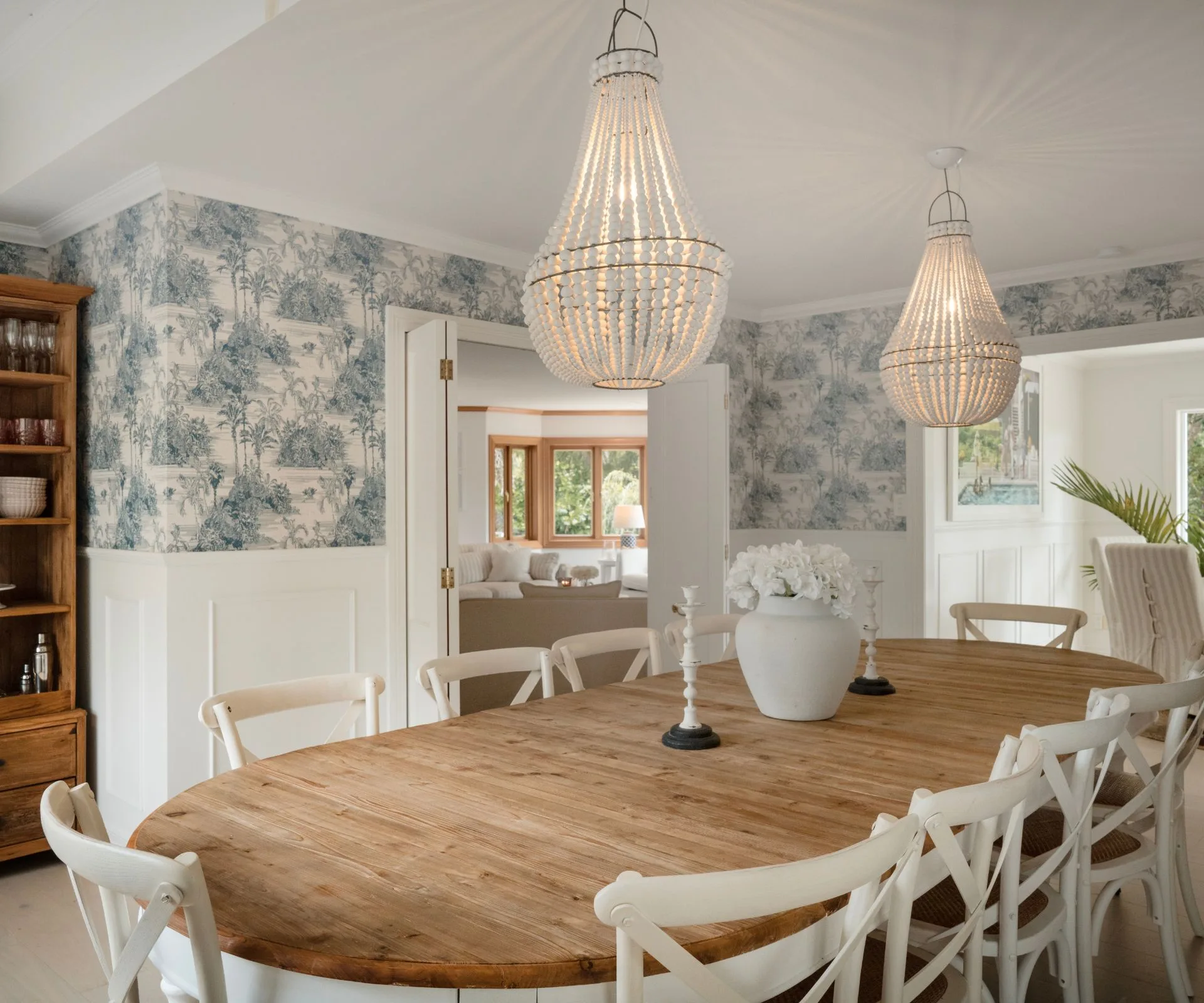 The dining room is wallpapered in a beautiful Hampton-style print from 
the Resene Eden Collection 
to create a cosy yet stylish atmosphere.