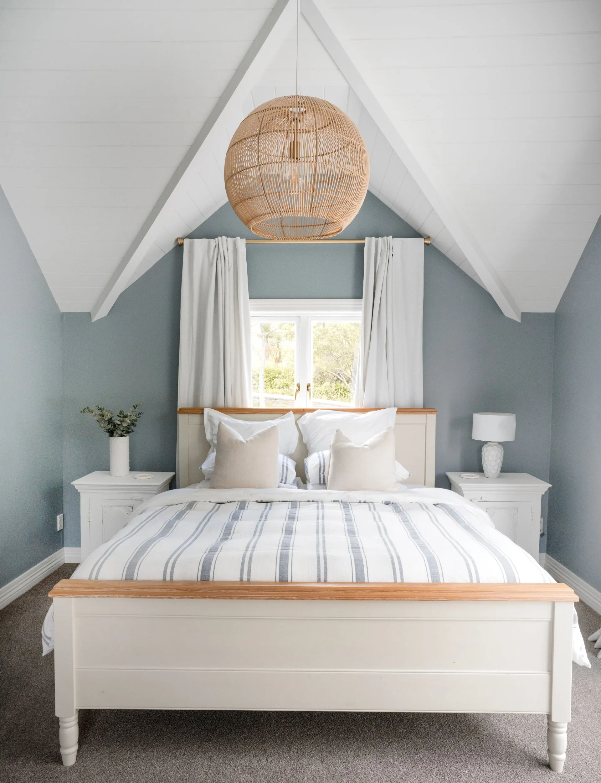 Coastal style bedroom in this Stillwater homestead