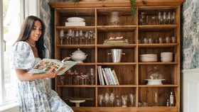 Christina Dellar reading a book in her Stillwater homestead