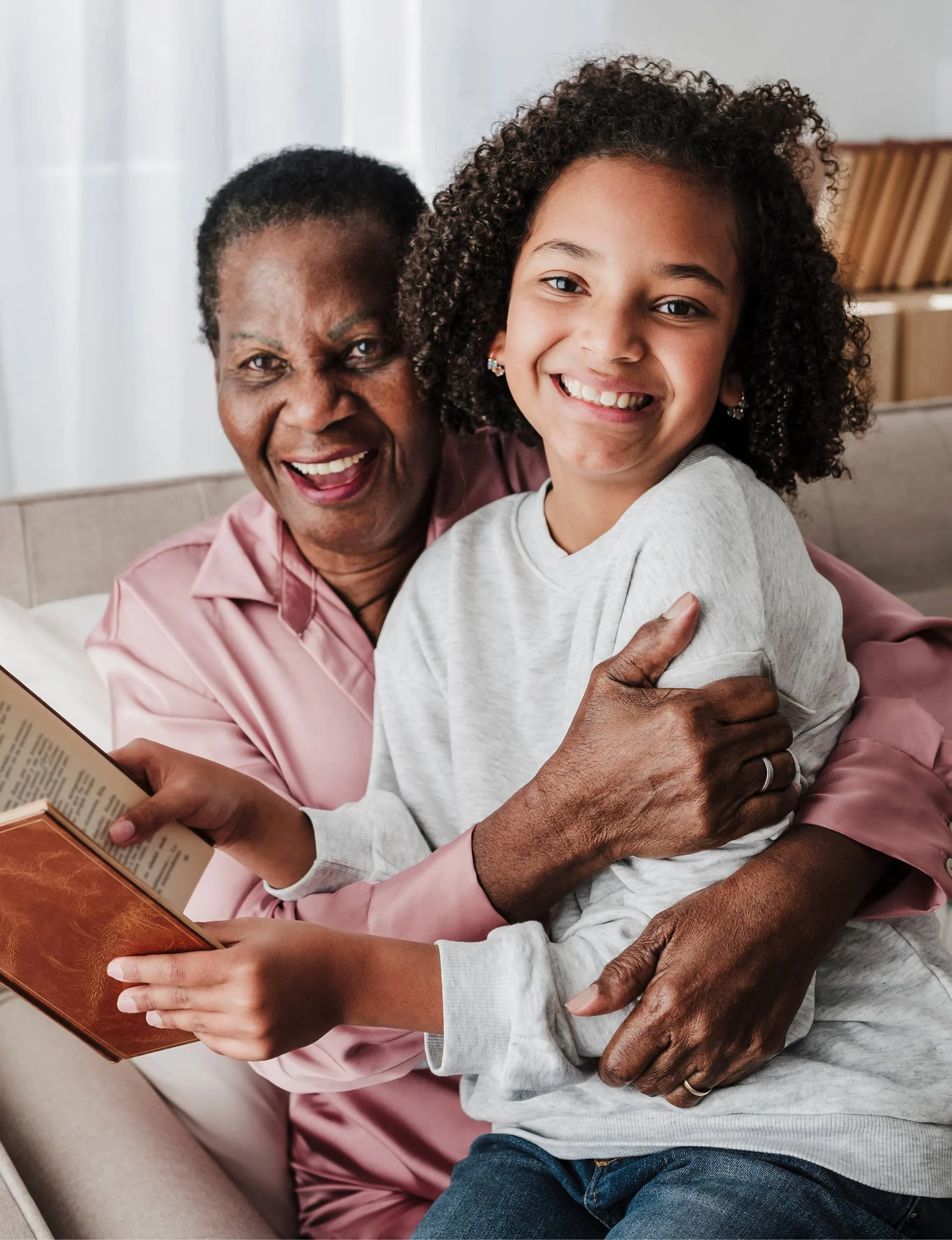 A mother and daughter reading a book about resilience
