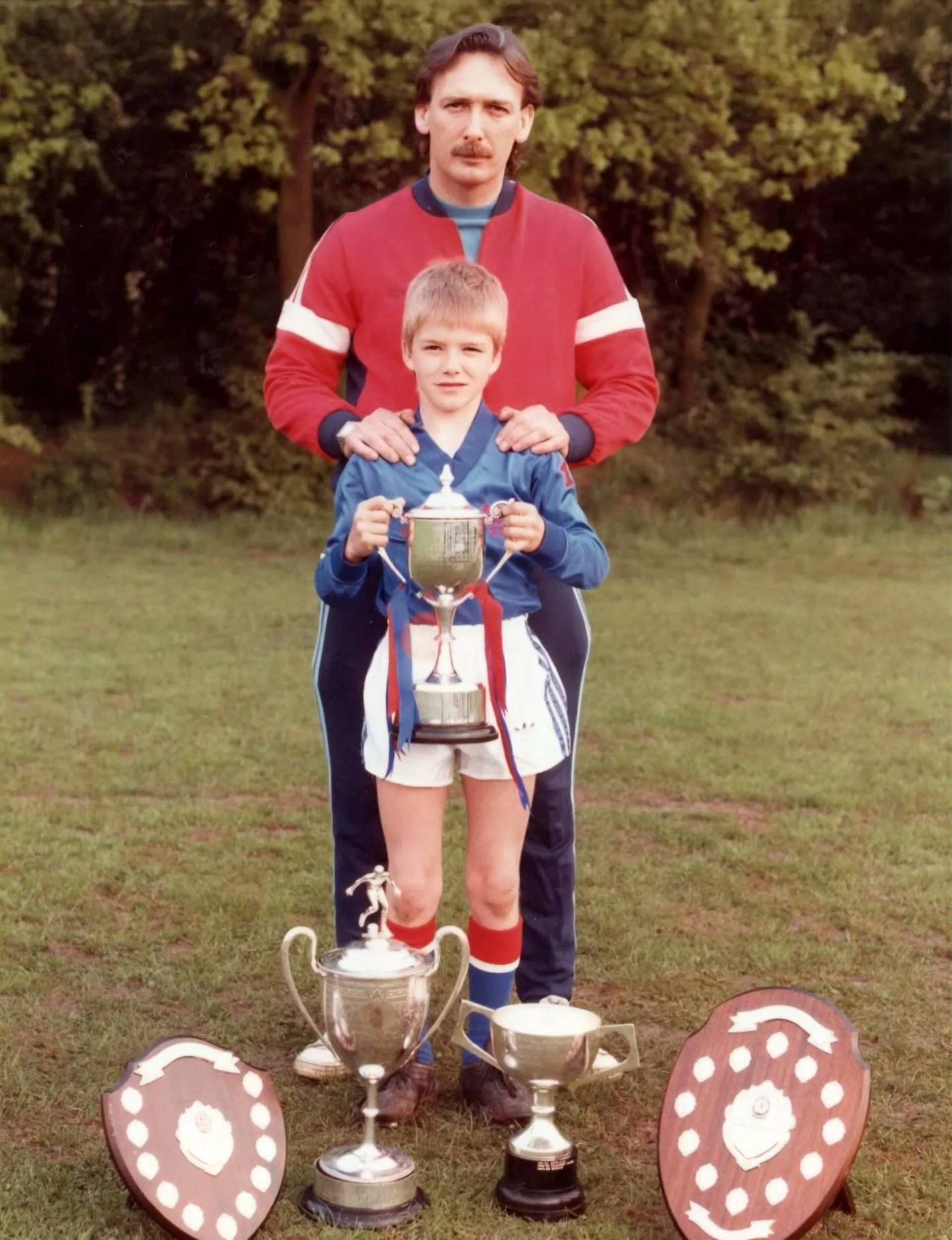 David Beckham as an 11-year-old with his dad and trophies won to date