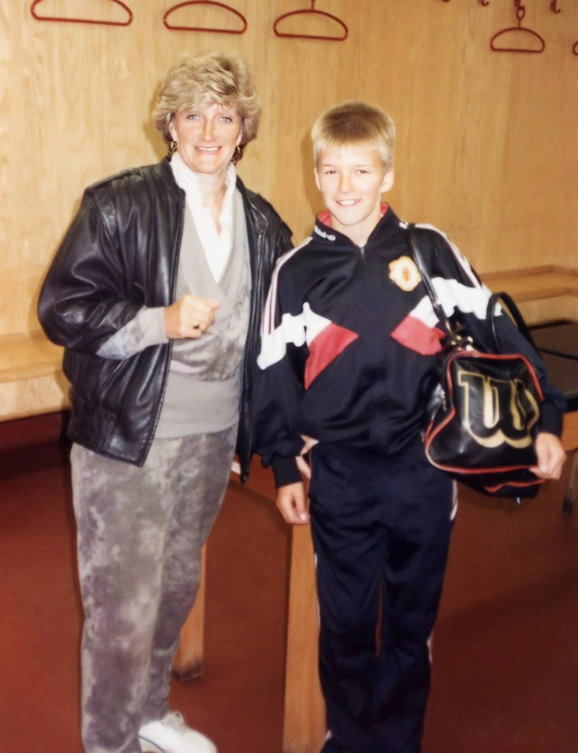David as a kid with his mother in some changing rooms