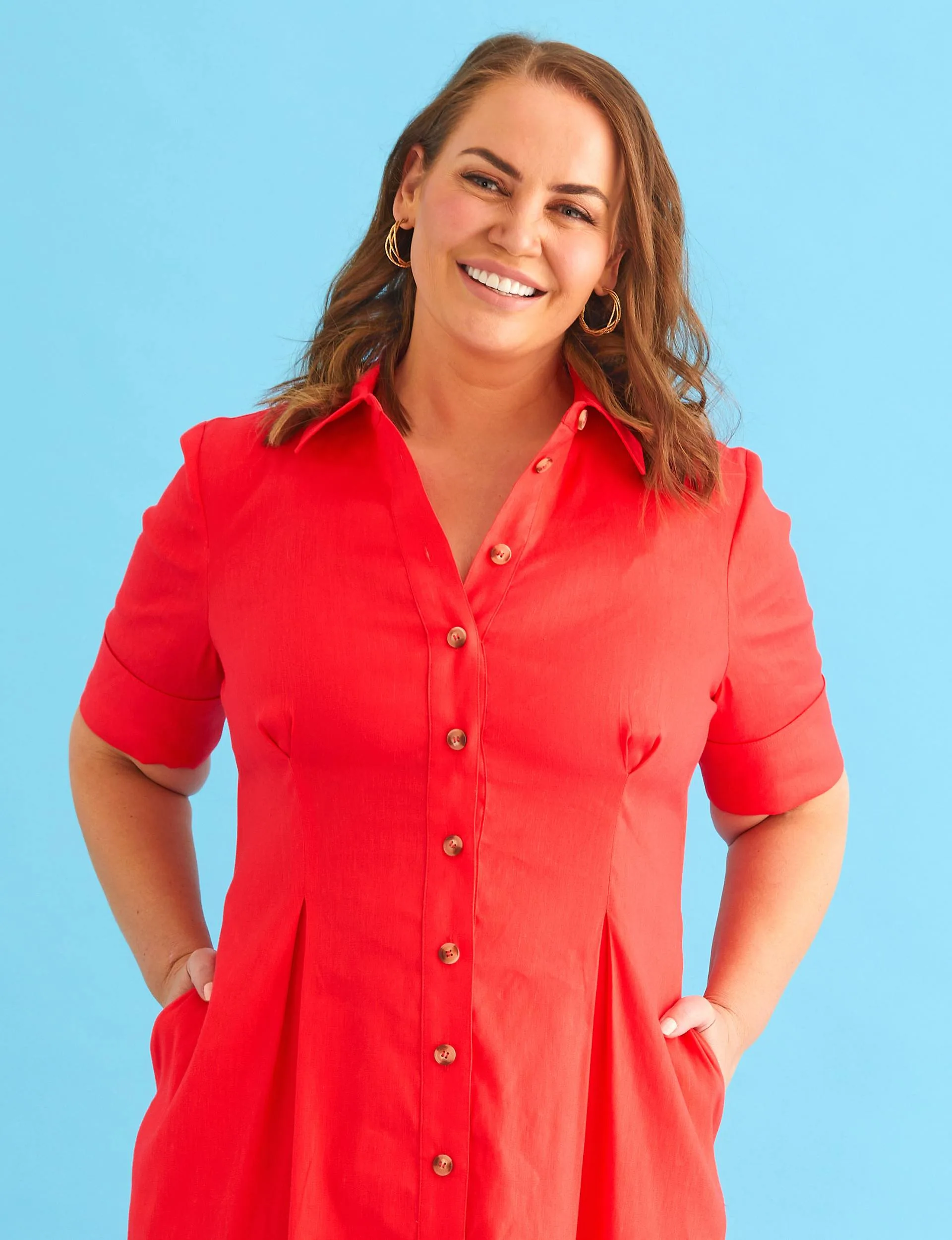 Jelena Dokic with her hands in the pockets of a red dress