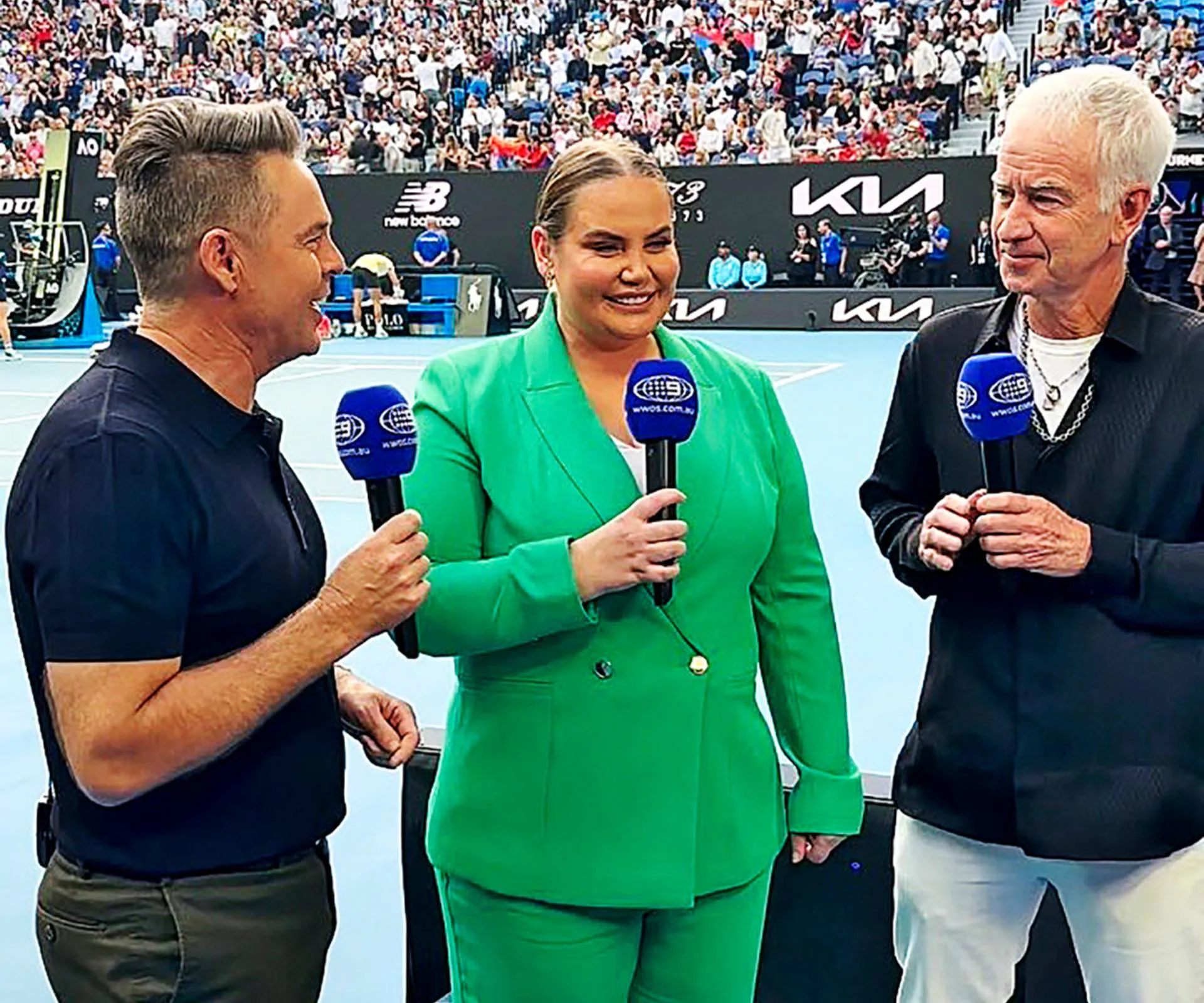 Jelena Dokic presenting for a news channel beside close friend Todd Woodridge