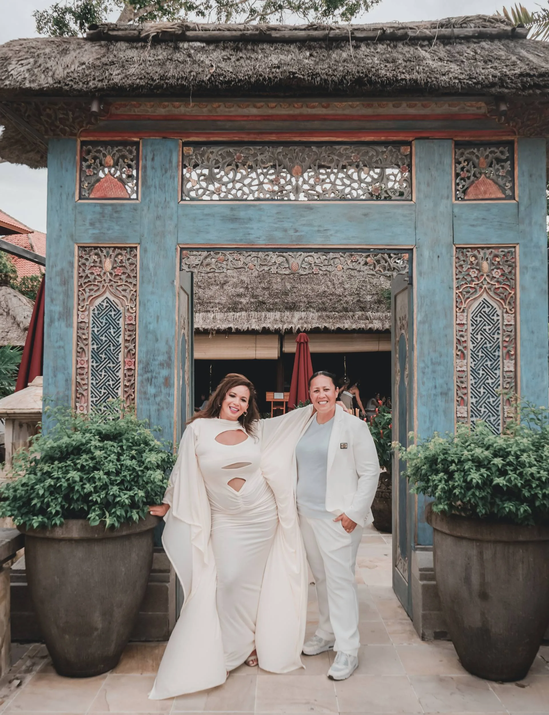 Megan and Nat in front of a temple on their honeymoon