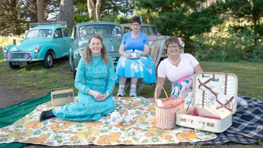 The three women with their Morris Minors