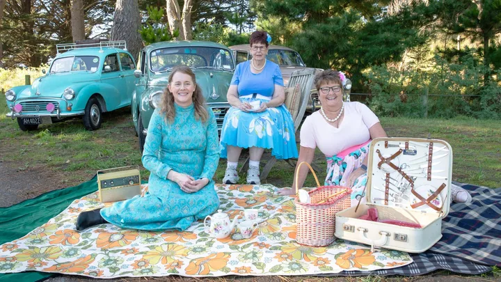 The three women with their Morris Minors