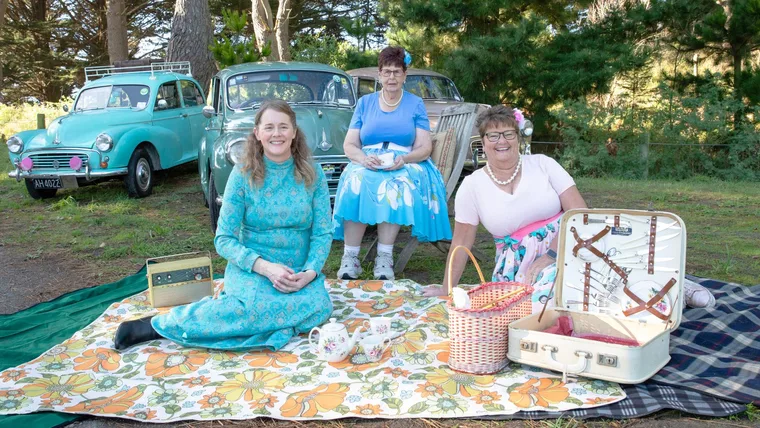 The three women with their Morris Minors