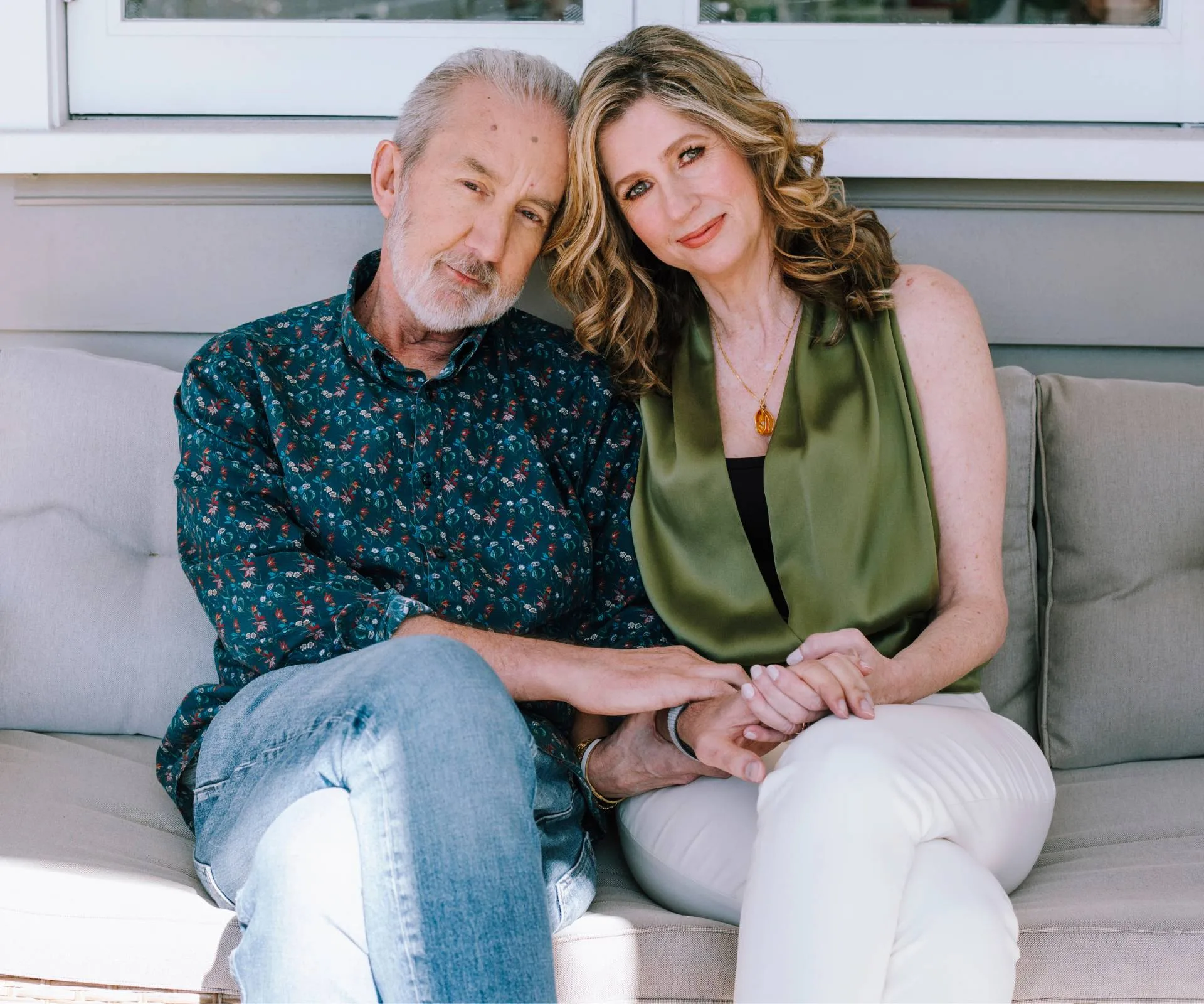 Nigel Latta on an outdoor couch with his wife Natalie