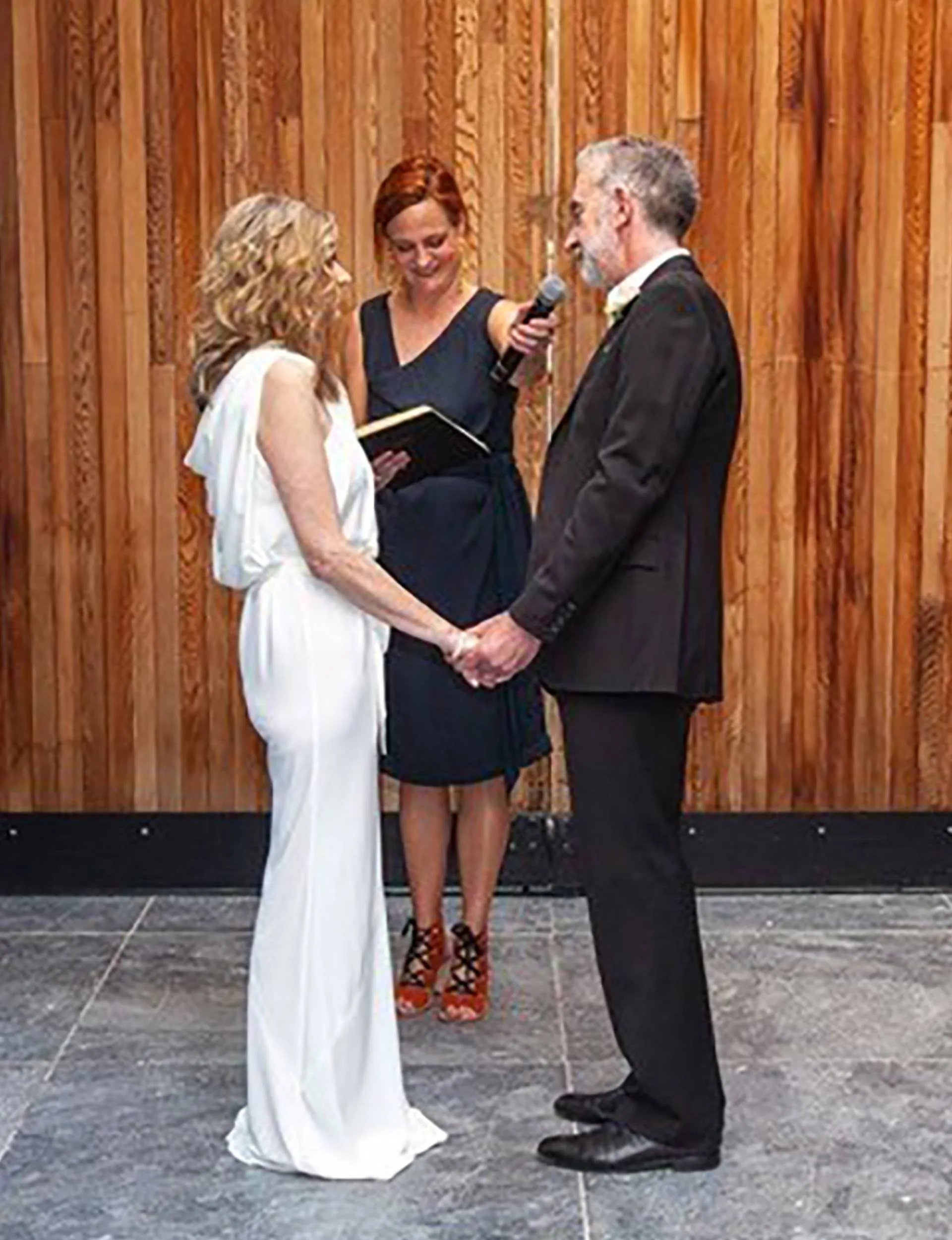 Nigel Latta exchanging vows with his wife Natalie on their wedding day