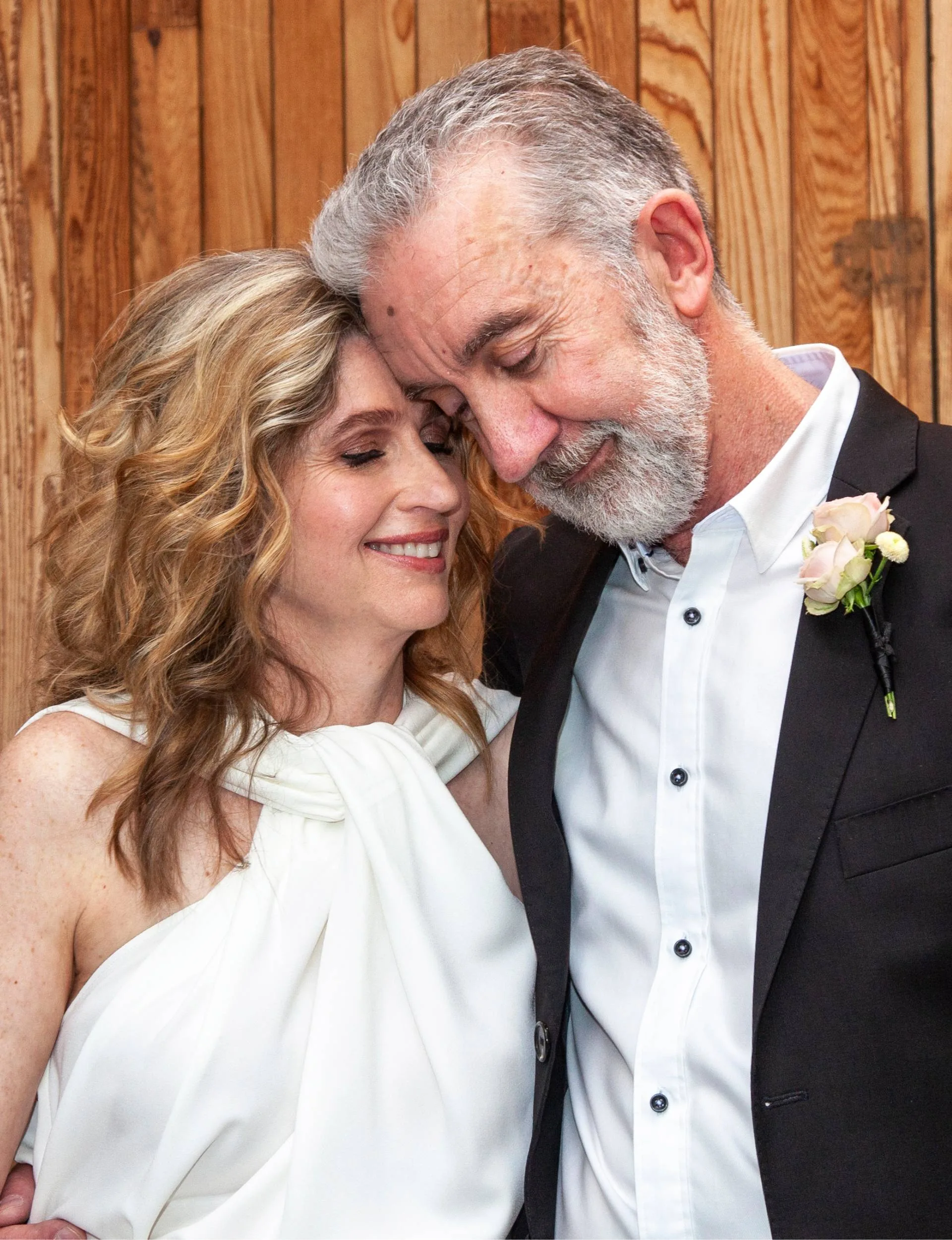 Nigel Latta hugging his wife Natalie on their wedding day