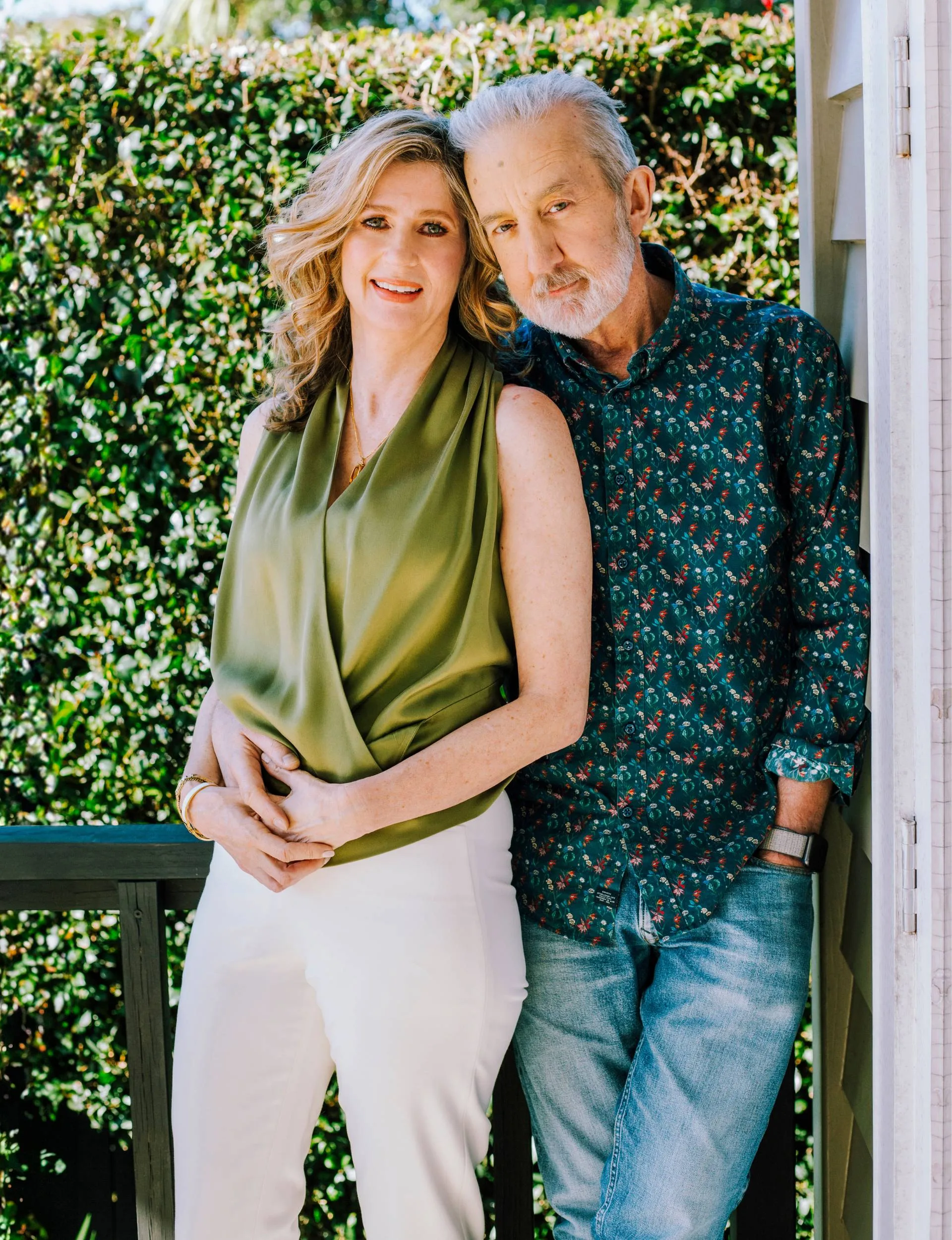 Nigel Latta leaning against a wall with his wife Natalie