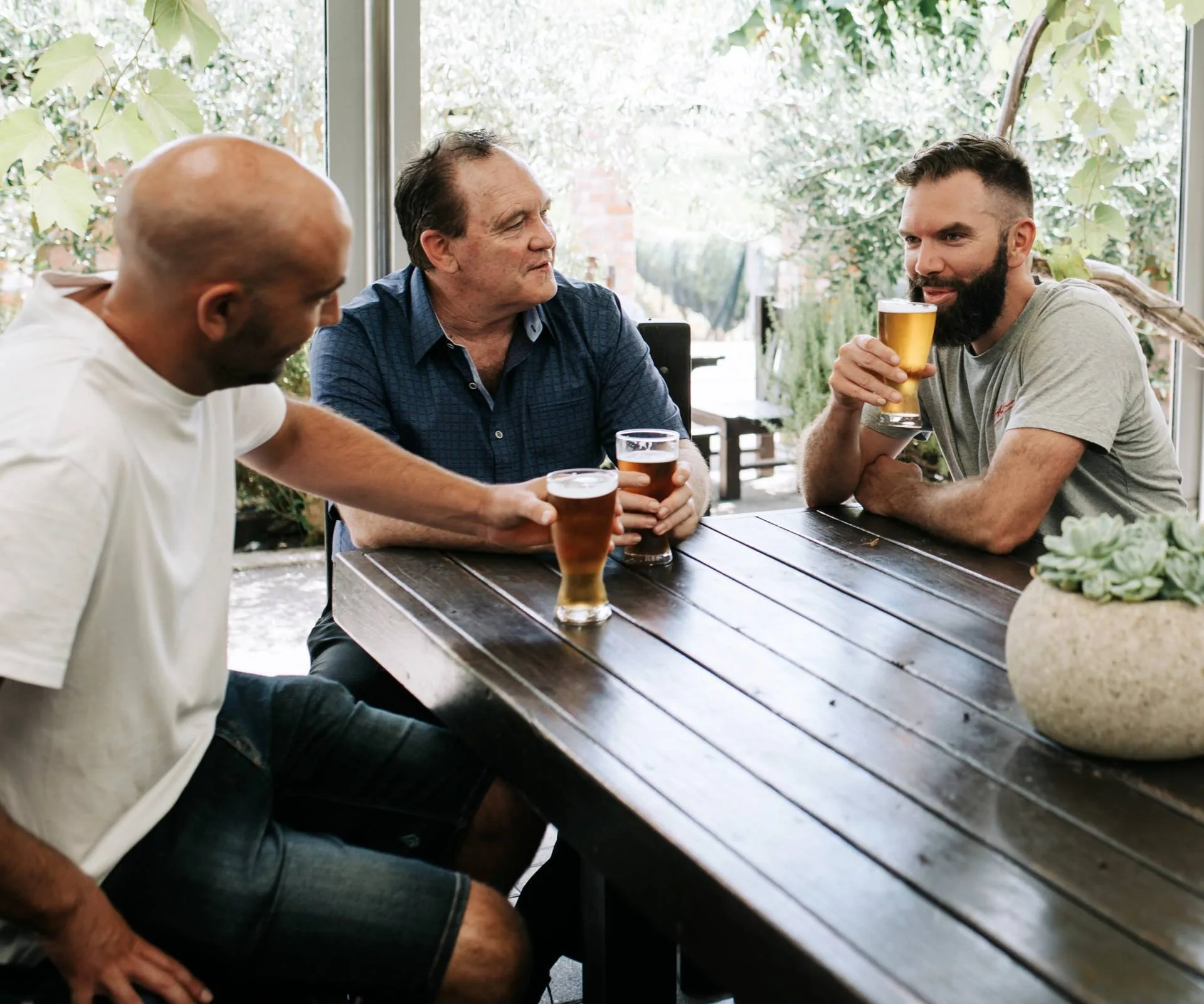 Between Two Beers podcast host Steve sharing a beer with his father and brother