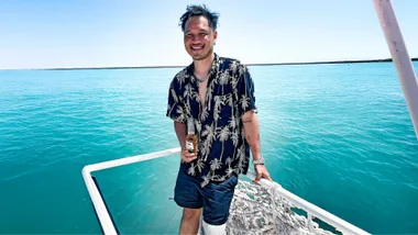 Terry Vo on the front of a boat