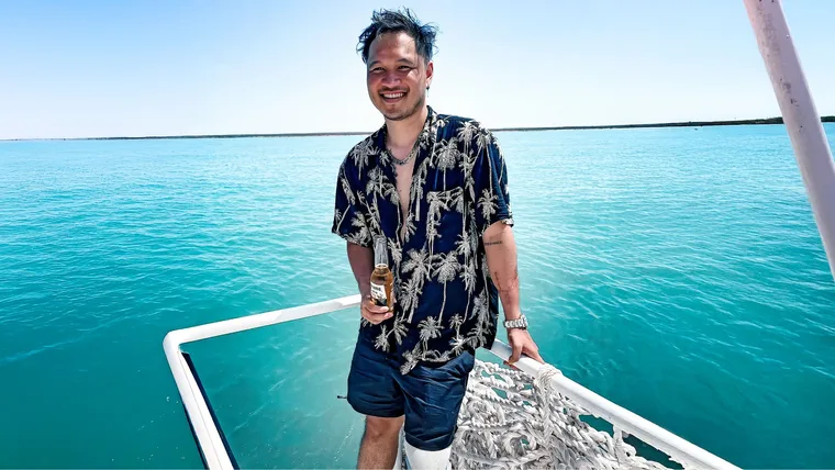 Terry Vo on the front of a boat
