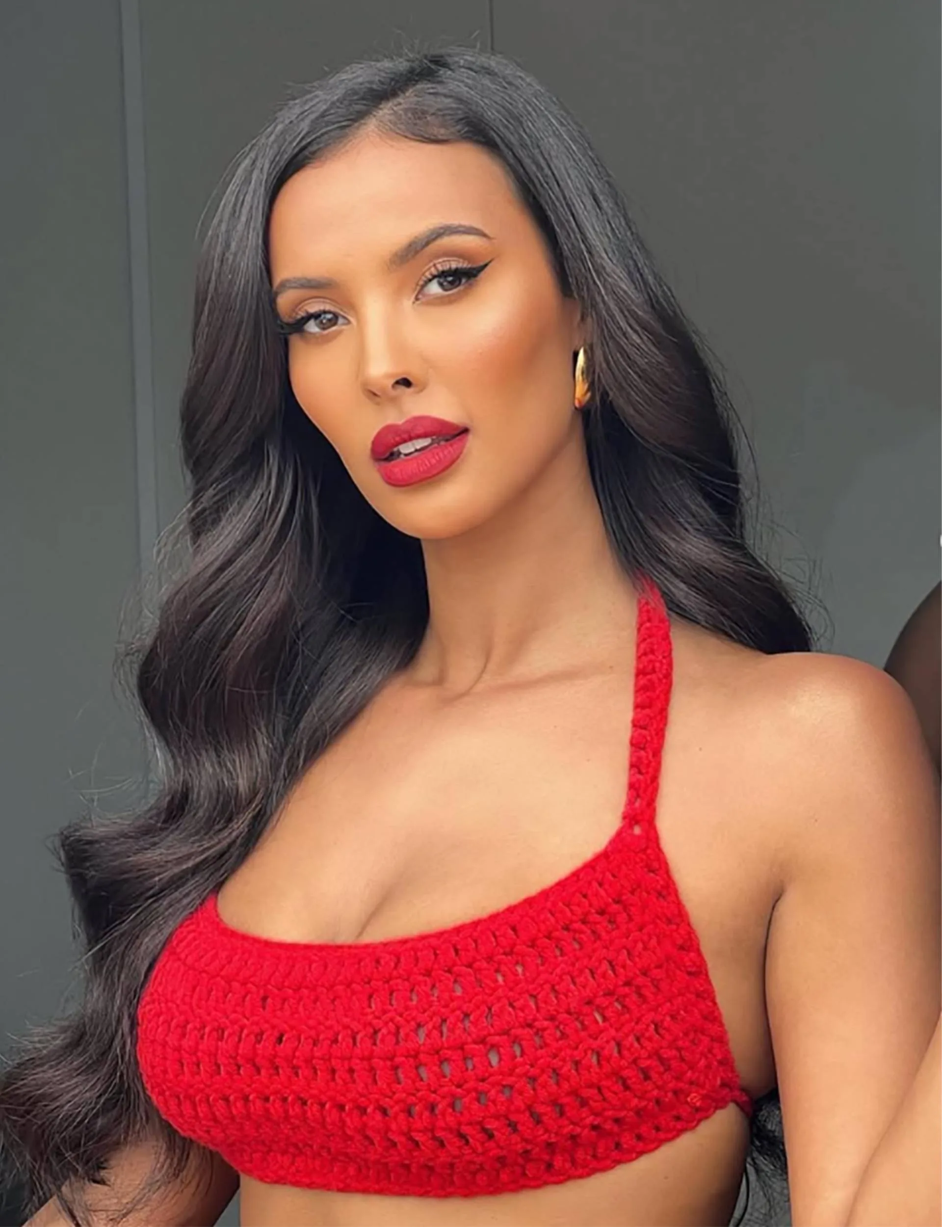 Maya Jama with a red lip