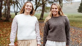 Anna and Kate Macdonald walking through their farm