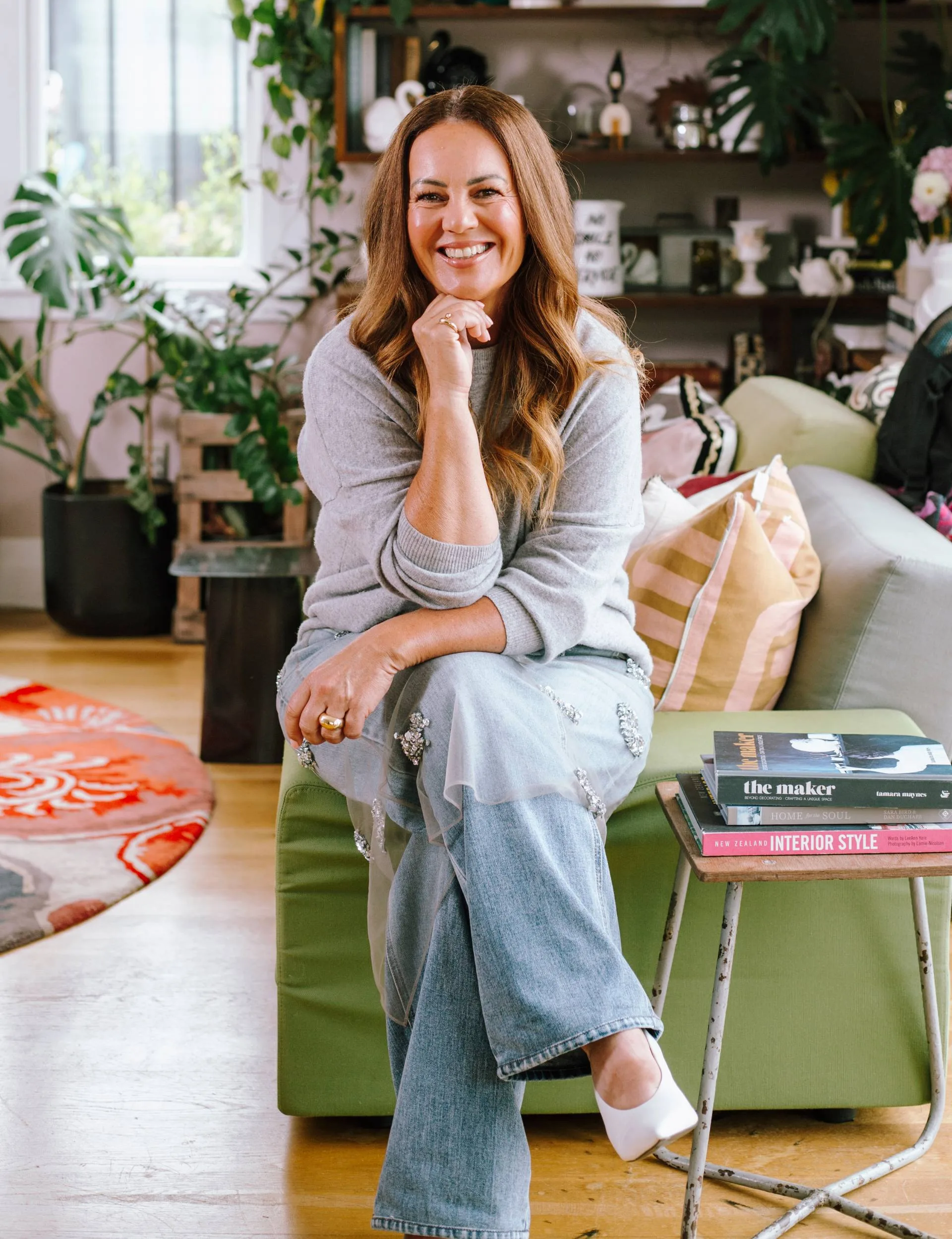 LeeAnn Yare sitting on a stool in the living room