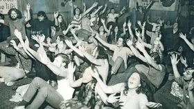 Cult members all preaching together in the 1960s