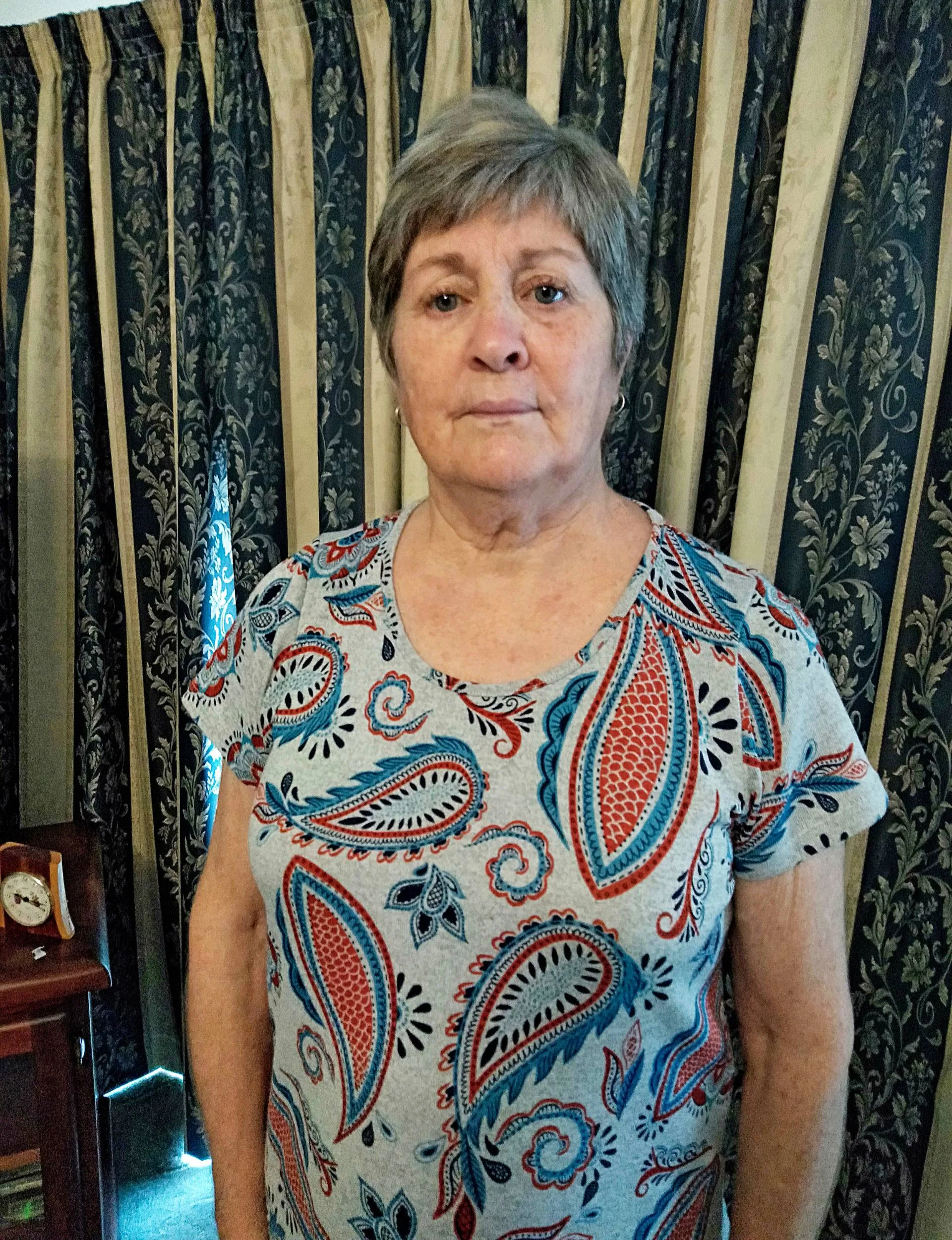 Catherine McDougall standing in her living room
