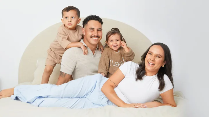 Ethan Ordish with his fiancee and kids on their bed