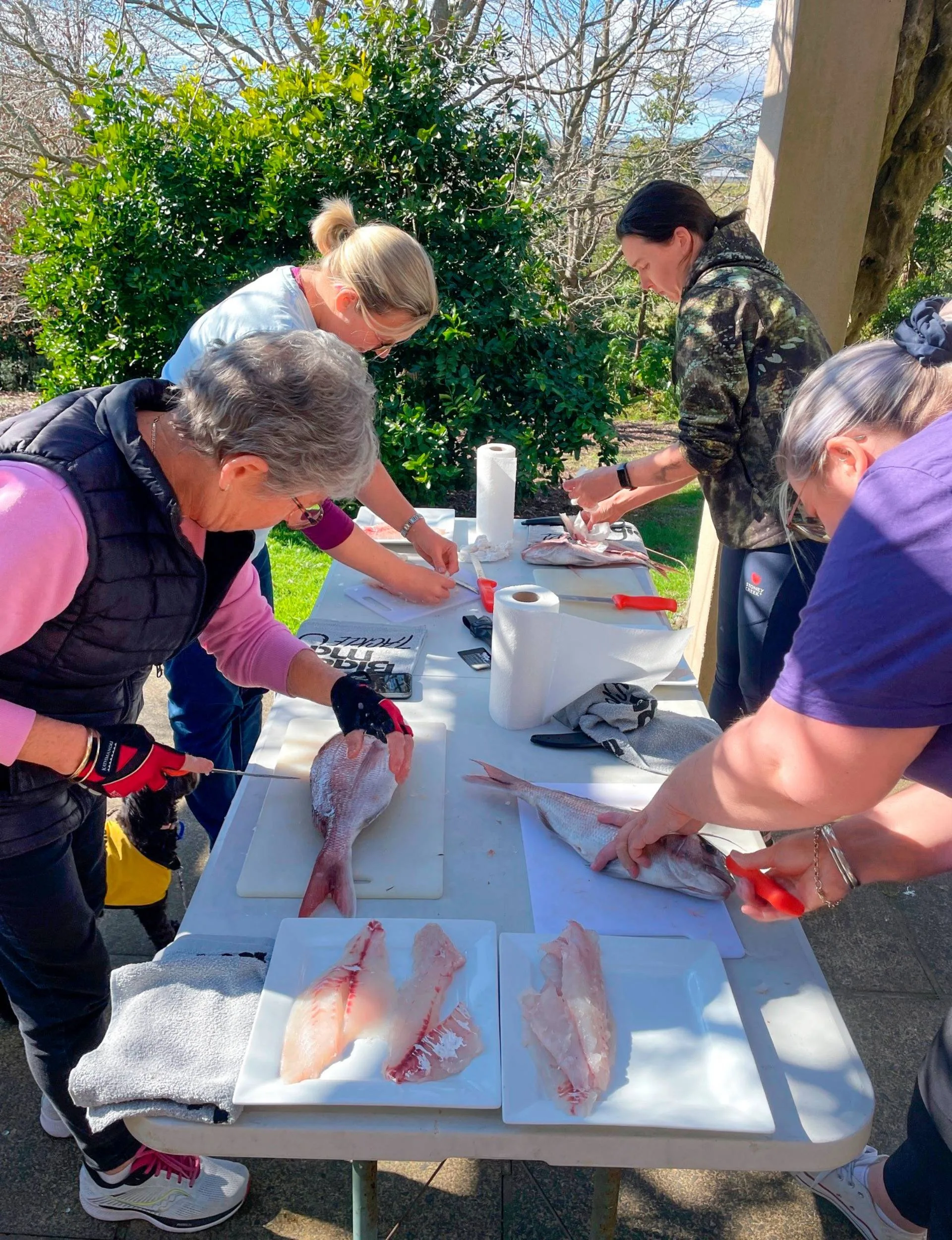 Isabell teaching a Wild Chix seminar on filleting a fish