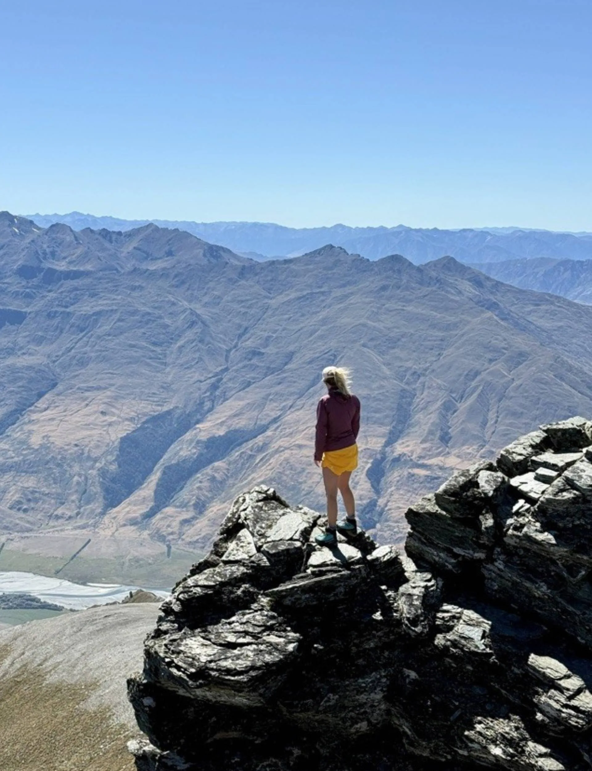 Cassandra Treadwell at the top of a mountain
