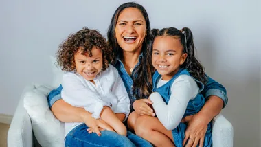 Dame Valerie Adams with her kids on her lap