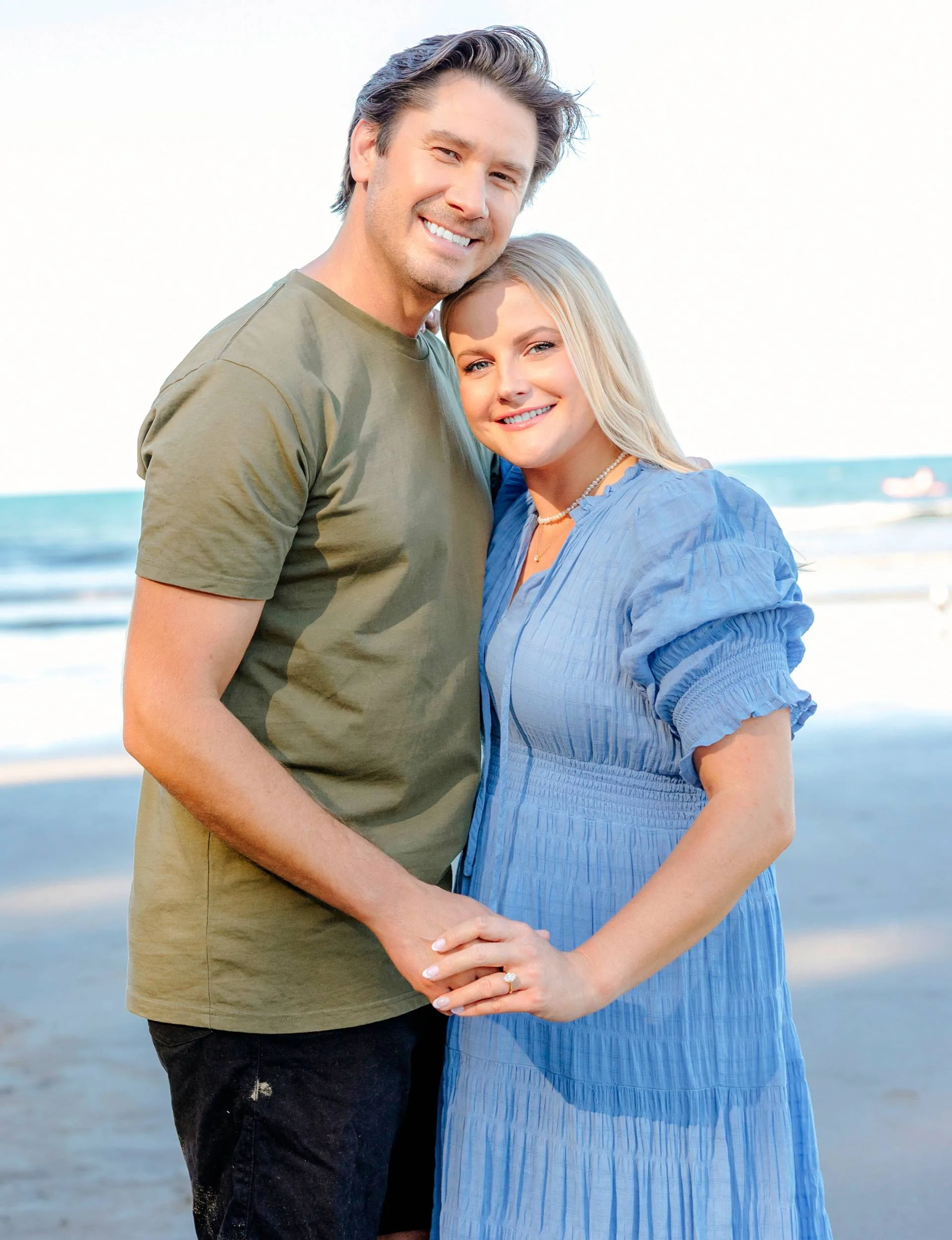 Sophie and brad on the beach after the proposal