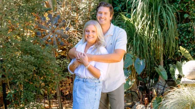 Sophie Morris with her partner on the beach where the proposal took place