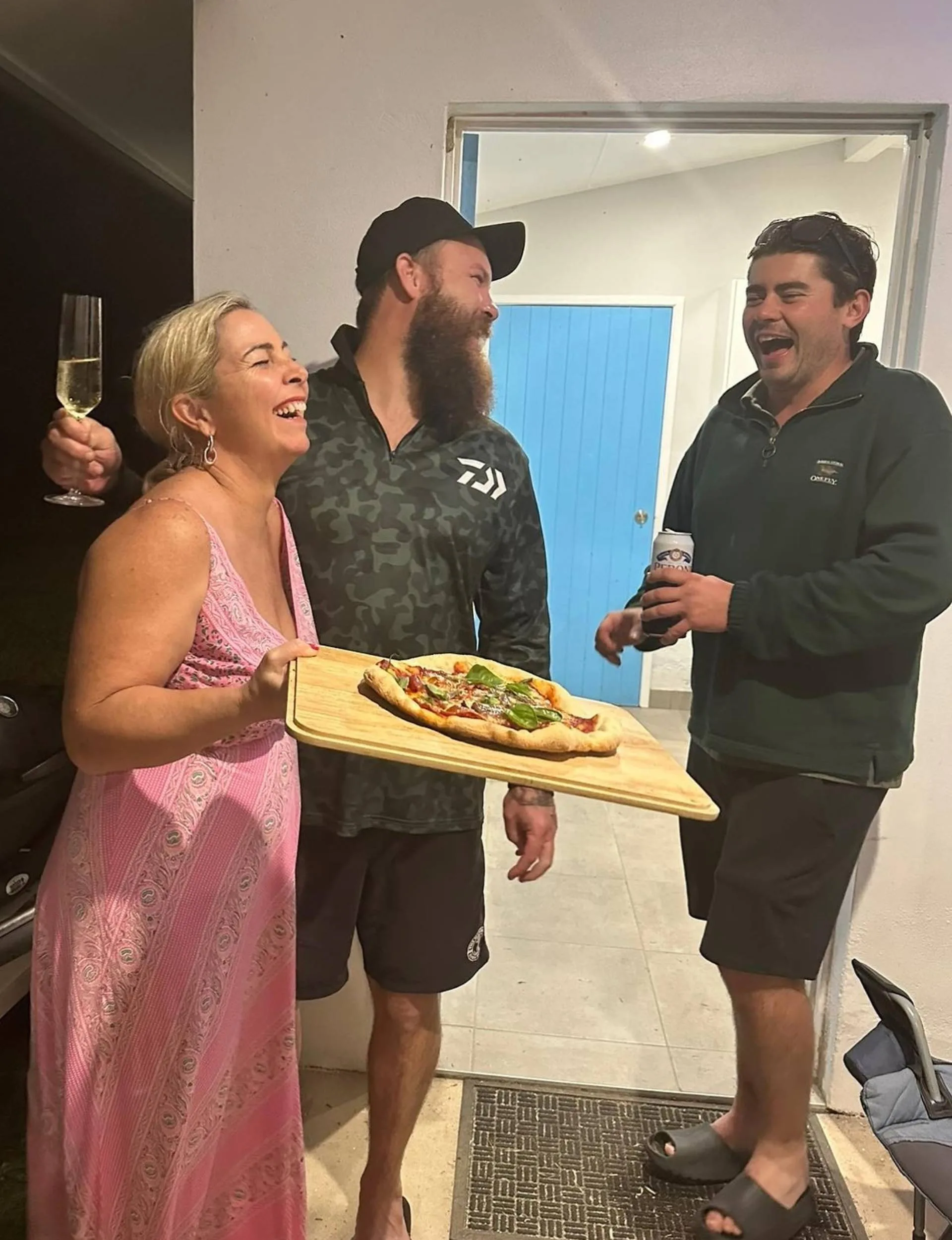 Declan and Rhiannon laughing in a home kitchen together