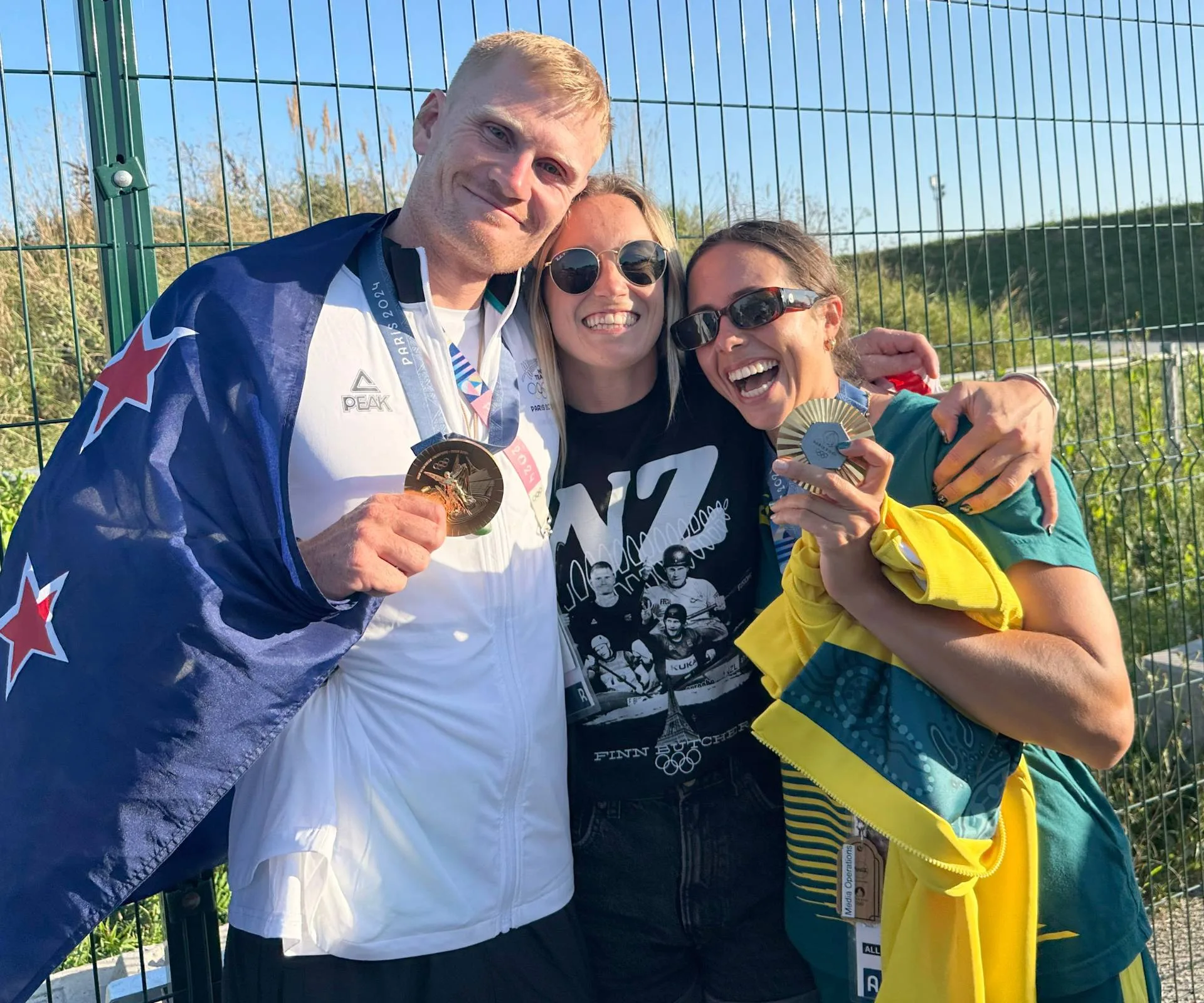 Finn Butcher celerating in Paris with his girlfriend and an Australian friend