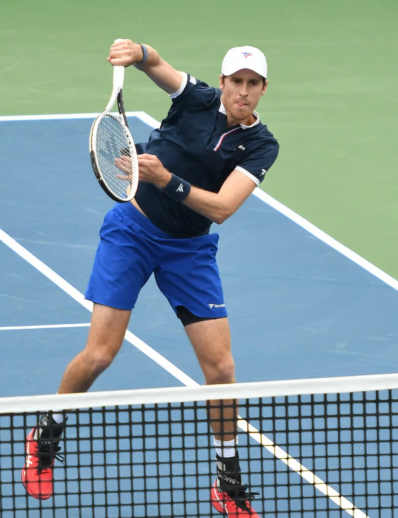 Marcus playing tennis