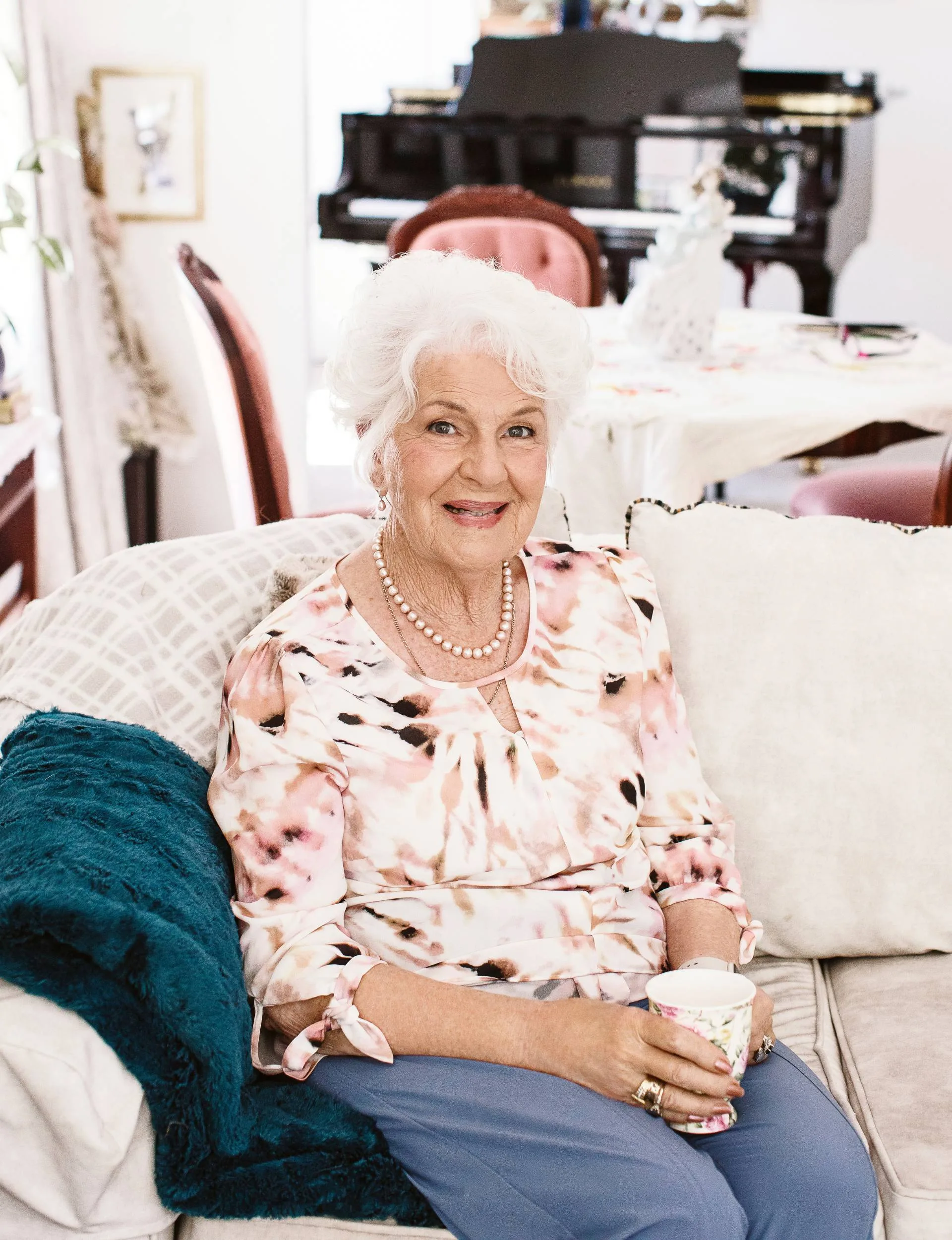 Dame sitting in living room
