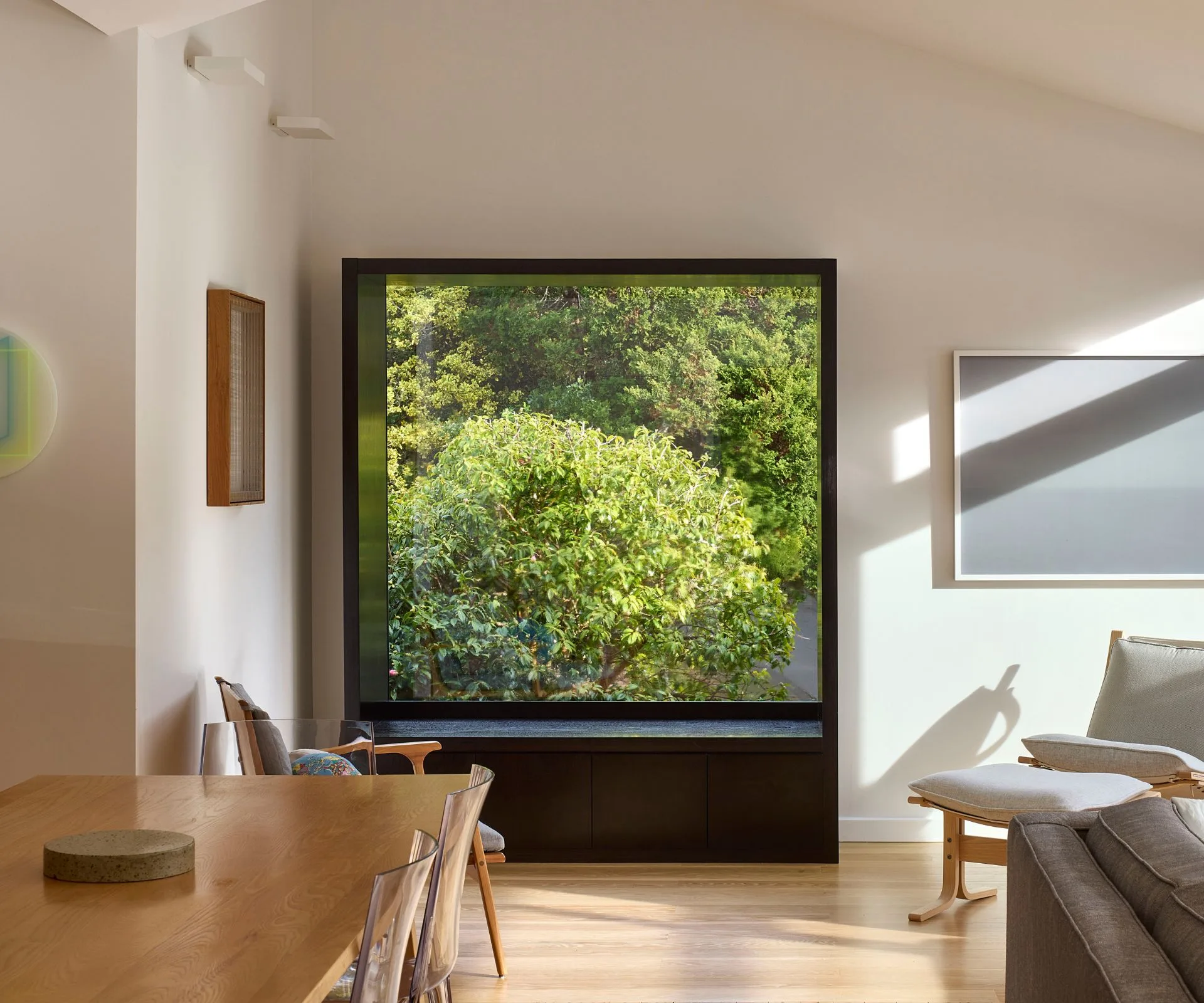 The modern bay window in this Khandallah home frames the greenery outside