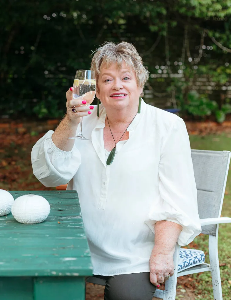 Alison with a glass in her hand