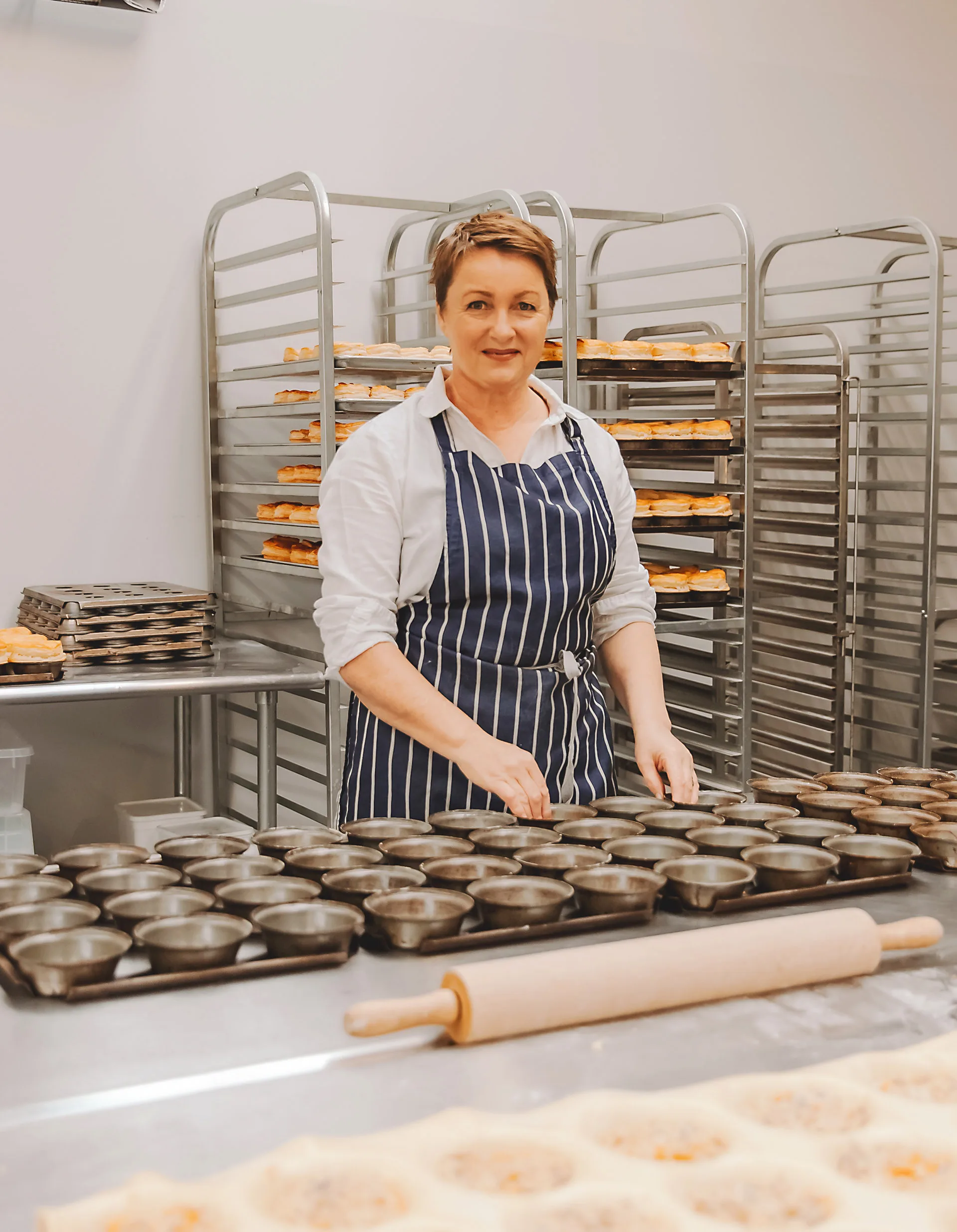 emily lucas in the back of her west coast pie co bakery preparing pies