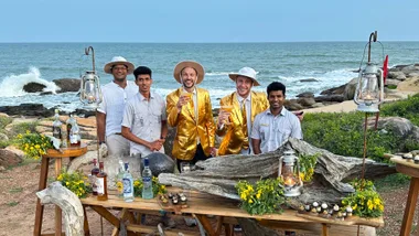Jono and ben in gold suits in water