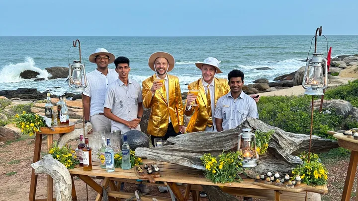 Jono and ben in gold suits in water