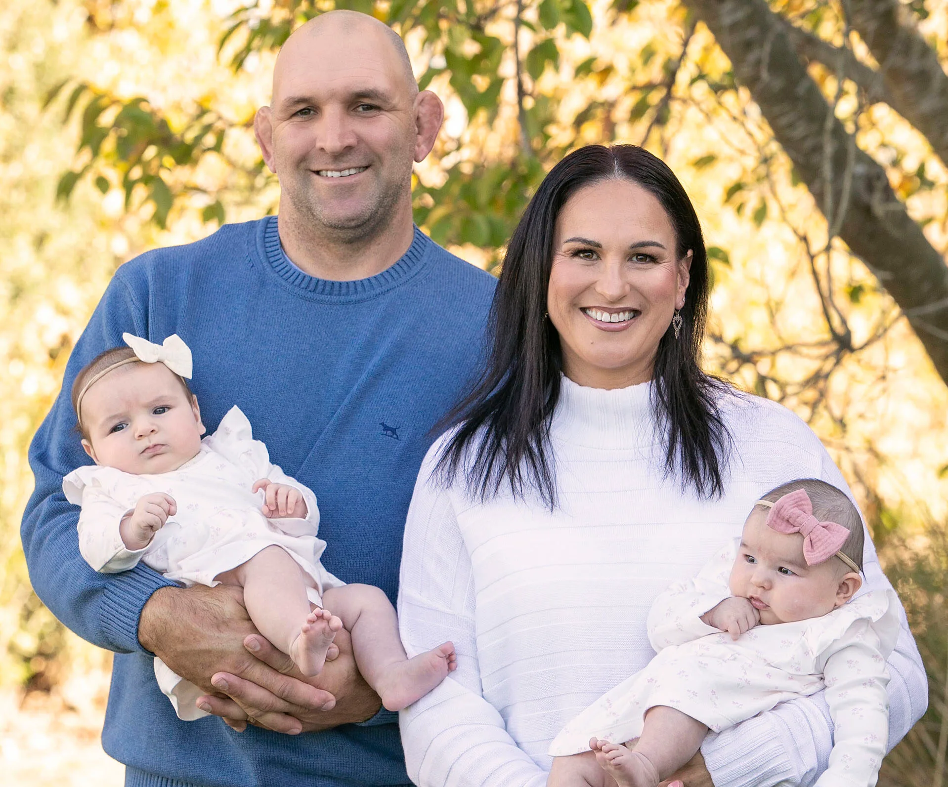 george and kayla whitelock holding twin daughters willow and harper